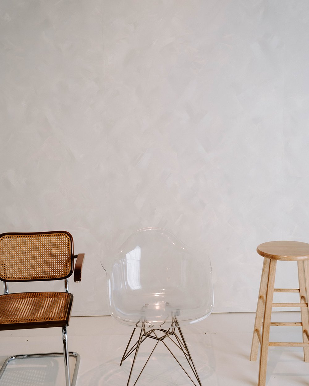 Cane chair, lucite chair and wood stool